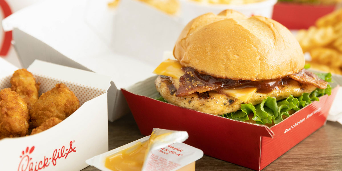 Chick-Fil-A chicken sandwich and chicken nuggets with a side of sauce