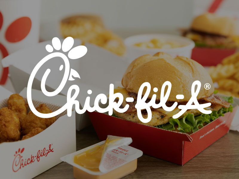 Chick-Fil-A logo over an image of Chick-Fil-A chicken sandwich and chicken nuggets with a side of sauce