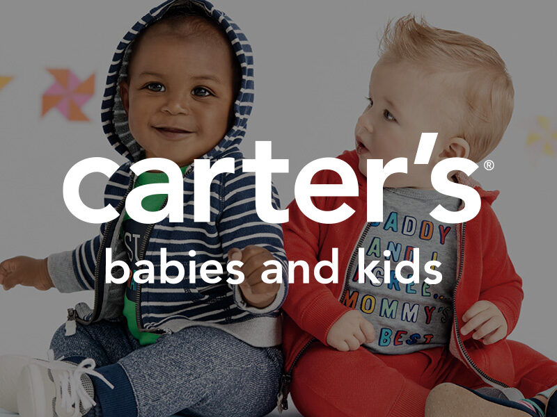 Carter's logo on top of a picture of a black baby and a white baby wearing colorful sweats.