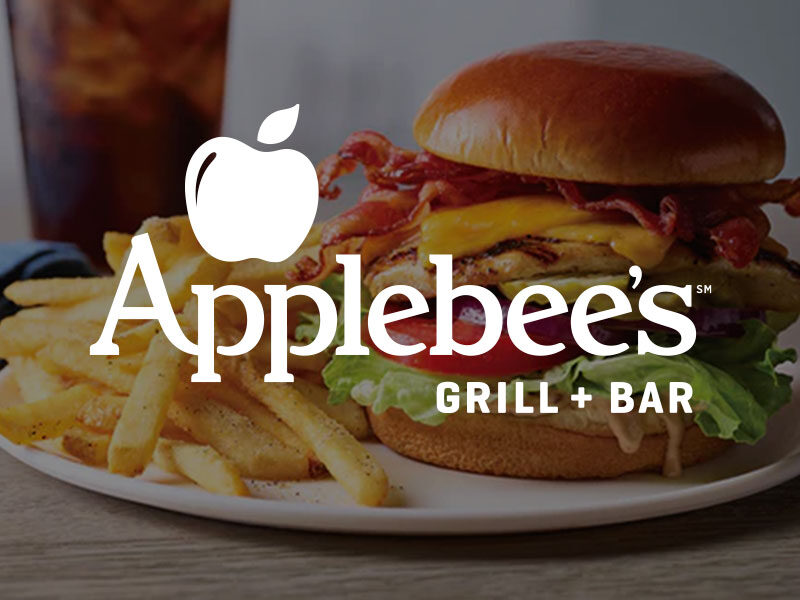 Applebee's logo over an image of a burger fries and soda
