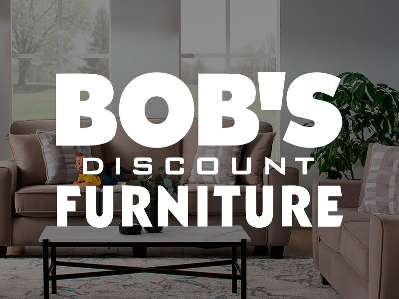 Bob's Discount Furniture logo over an image of a living room