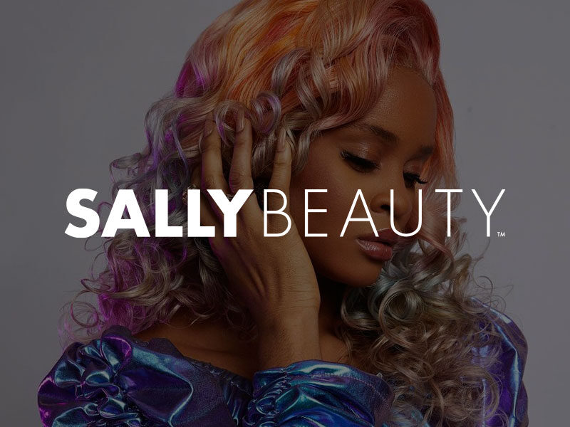 Sally Beauty logo over an image of a Attractive black woman with her hair dyed pink, orange and purple.